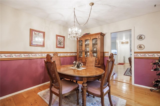 126 True Hickory Dr, Greece, NY 14615 - dining area with a chandelier and light wood finished floors