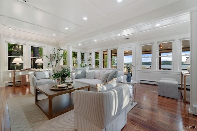 97 Burtis Point Rd, Owasco, NY 13021 - living area featuring a baseboard heating unit, ornamental molding, hardwood / wood-style floors, baseboard heating, and recessed lighting