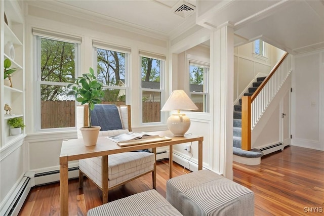 97 Burtis Point Rd, Owasco, NY 13021 - sitting room with ornamental molding, wood finished floors, plenty of natural light, and stairs