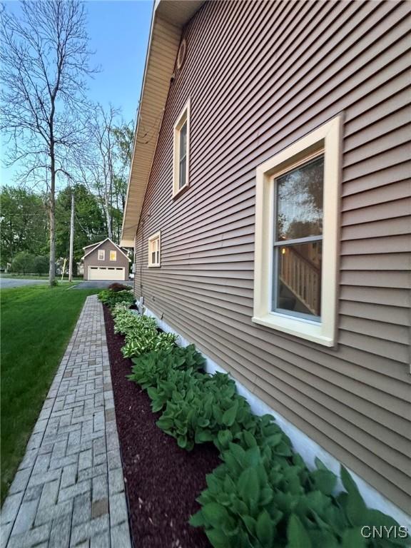 97 Burtis Point Rd, Owasco, NY 13021 - view of home's exterior featuring a yard