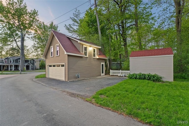 97 Burtis Point Rd, Owasco, NY 13021 - view of property exterior with driveway, a shingled roof, and a garage
