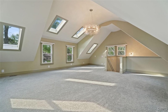 97 Burtis Point Rd, Owasco, NY 13021 - bonus room featuring a skylight, carpet flooring, vaulted ceiling, a chandelier, and baseboards