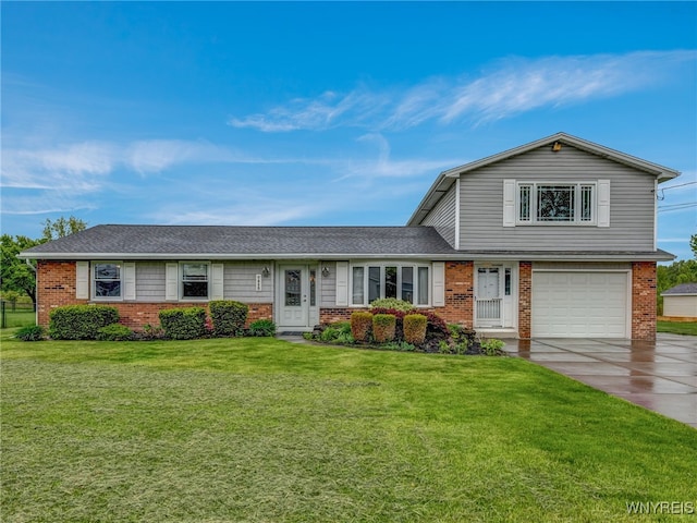 7415 Colonial Dr, Niagara, NY 14305 - view of front of home with brick siding, a garage, driveway, a front yard, and roof with shingles