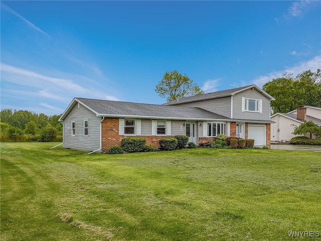 7415 Colonial Dr, Niagara, NY 14305 - view of front of home with a garage, brick siding, asphalt driveway, and a front lawn