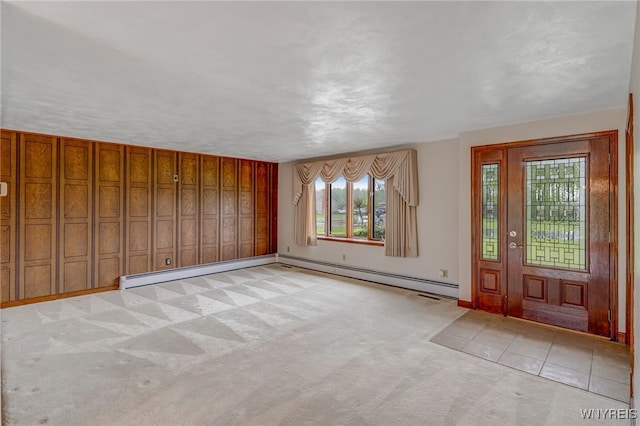 7415 Colonial Dr, Niagara, NY 14305 - foyer entrance with light colored carpet, baseboards, and a baseboard radiator