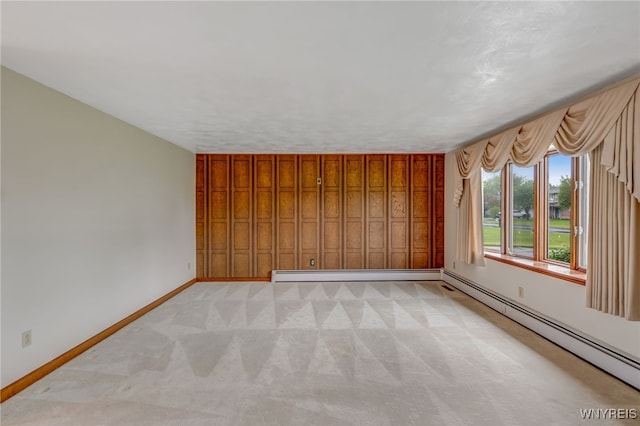 7415 Colonial Dr, Niagara, NY 14305 - empty room featuring light carpet, baseboards, and a baseboard heating unit