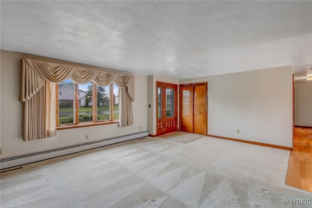 7415 Colonial Dr, Niagara, NY 14305 - carpeted spare room with a baseboard radiator and baseboards