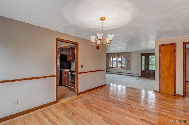 7415 Colonial Dr, Niagara, NY 14305 - empty room with a baseboard heating unit, a chandelier, light wood-type flooring, and baseboards