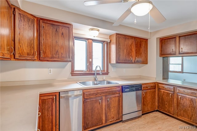 7415 Colonial Dr, Niagara, NY 14305 - kitchen featuring dishwasher, a sink, a ceiling fan, and brown cabinets
