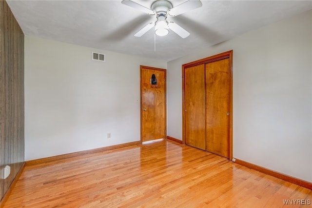 7415 Colonial Dr, Niagara, NY 14305 - unfurnished bedroom with light wood-style floors, baseboards, a closet, and ceiling fan