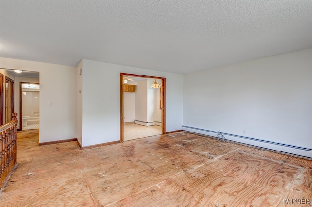 7415 Colonial Dr, Niagara, NY 14305 - empty room featuring a textured ceiling, baseboard heating, and baseboards