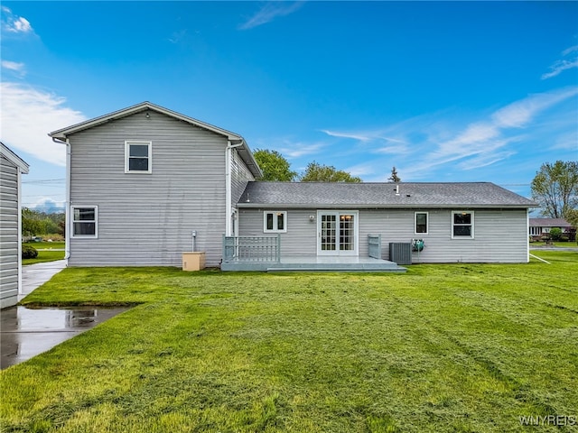 7415 Colonial Dr, Niagara, NY 14305 - back of house with a lawn, central AC, and a deck