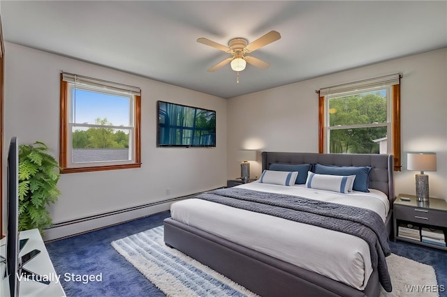 7415 Colonial Dr, Niagara, NY 14305 - bedroom featuring carpet flooring, a baseboard heating unit, and a ceiling fan