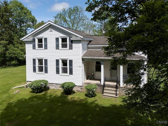7078 Fuller Rd, Aurelius, NY 13140 - view of front of property featuring a front yard, a shingled roof, and covered porch