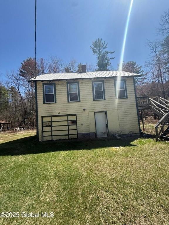 8000 State Route 8, Horicon, NY 12815 - back of house with a chimney, a lawn, metal roof, and stairs