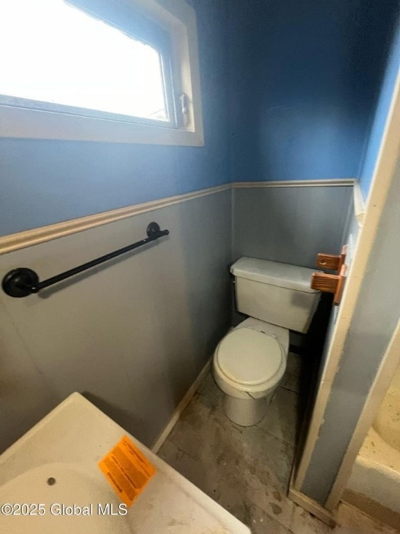 264 State Highway 5s, Florida, NY 12137 - bathroom featuring toilet and a wainscoted wall
