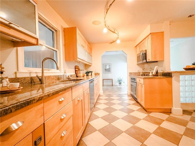 31 Overbrook Rd, Pittsford, NY 14618 - kitchen featuring appliances with stainless steel finishes, light brown cabinetry, a sink, and stone countertops