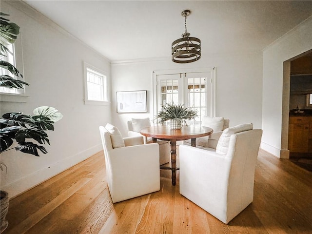 31 Overbrook Rd, Pittsford, NY 14618 - dining area with ornamental molding, a chandelier, light wood-style flooring, and baseboards