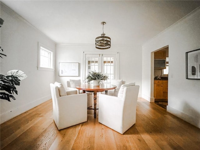 31 Overbrook Rd, Pittsford, NY 14618 - dining space featuring a chandelier, crown molding, light wood-type flooring, and baseboards