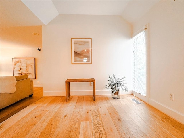 31 Overbrook Rd, Pittsford, NY 14618 - living area with vaulted ceiling, wood-type flooring, and baseboards