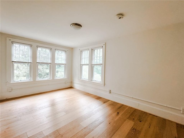 31 Overbrook Rd, Pittsford, NY 14618 - spare room featuring wood finished floors, a smoke detector, and baseboards