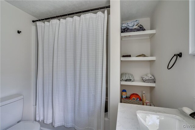 1010 Academy St, Watertown-City, NY 13601 - full bath with toilet and shower / bath combo with shower curtain