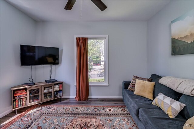 1010 Academy St, Watertown-City, NY 13601 - living room featuring ceiling fan, wood finished floors, and baseboards
