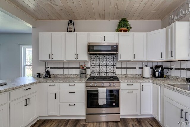1010 Academy St, Watertown-City, NY 13601 - kitchen featuring stainless steel appliances, white cabinetry, wooden ceiling, decorative backsplash, and crown molding