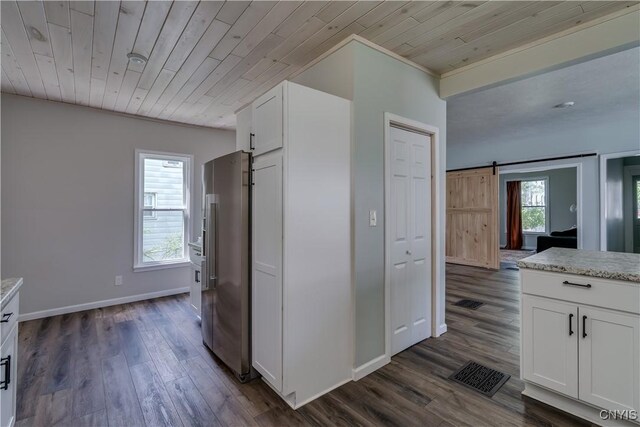1010 Academy St, Watertown-City, NY 13601 - kitchen featuring high end fridge, a barn door, white cabinets, dark wood-style flooring, and wooden ceiling