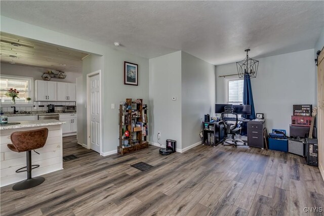 1010 Academy St, Watertown-City, NY 13601 - home office featuring dark wood-style flooring, baseboards, and a sink