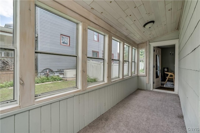 1010 Academy St, Watertown-City, NY 13601 - unfurnished sunroom featuring carpet and vaulted ceiling
