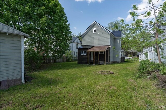 1010 Academy St, Watertown-City, NY 13601 - back of house featuring metal roof and entry steps