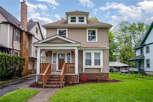 162 Post Ave, Rochester, NY 14619 - traditional style home featuring a front lawn, covered porch, and a shingled roof