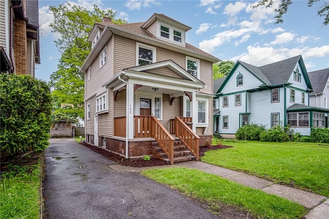 162 Post Ave, Rochester, NY 14619 - american foursquare style home featuring a chimney and a front lawn