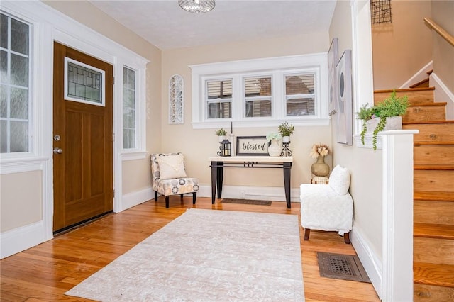 162 Post Ave, Rochester, NY 14619 - entrance foyer with stairs, wood finished floors, and baseboards