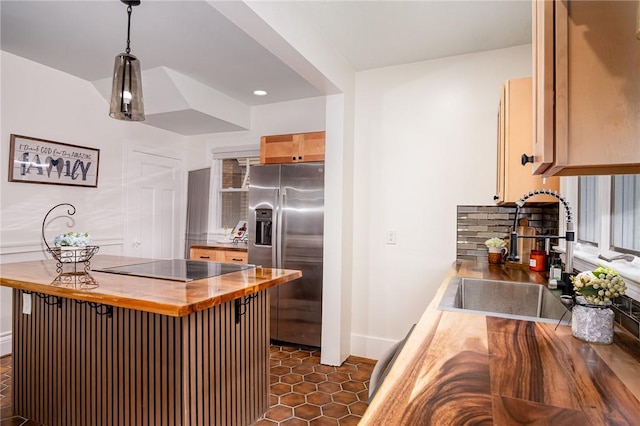 162 Post Ave, Rochester, NY 14619 - kitchen featuring butcher block countertops, stainless steel refrigerator with ice dispenser, a sink, decorative backsplash, and black electric stovetop