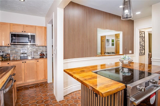 162 Post Ave, Rochester, NY 14619 - kitchen with appliances with stainless steel finishes, light brown cabinets, decorative backsplash, recessed lighting, and wood counters