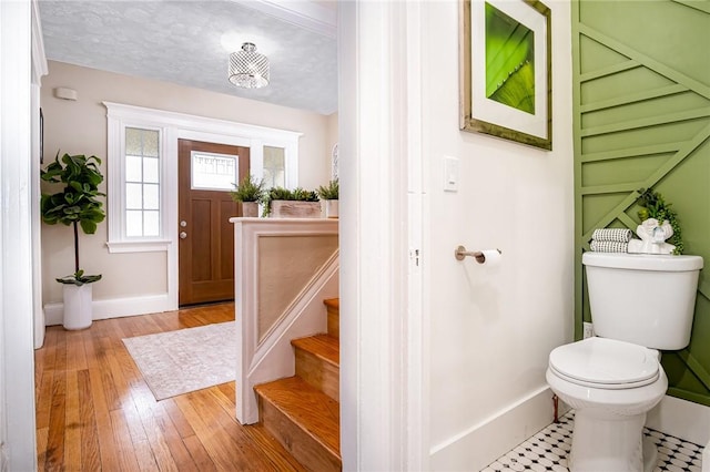 162 Post Ave, Rochester, NY 14619 - foyer entrance with baseboards, stairs, and wood finished floors