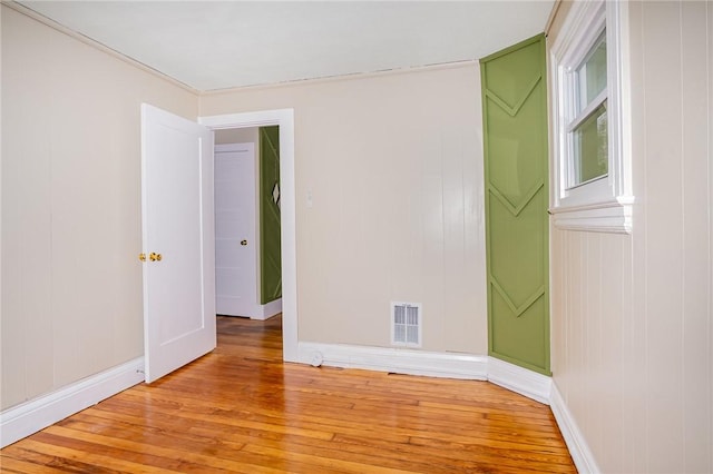 162 Post Ave, Rochester, NY 14619 - spare room featuring light wood-style flooring and baseboards