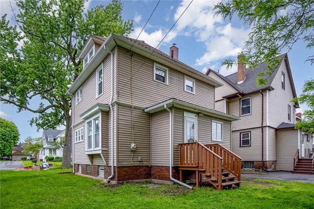 162 Post Ave, Rochester, NY 14619 - back of house with a yard and a chimney