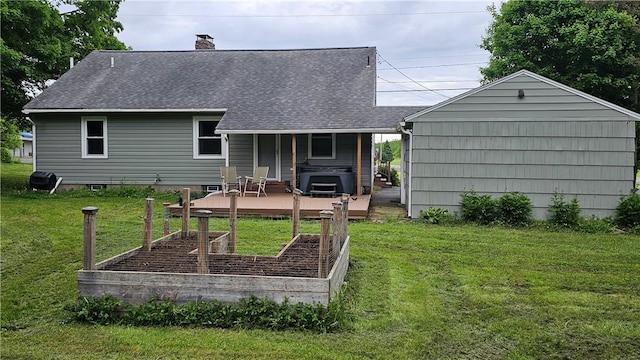 5267 Wheeler Rd, Elbridge, NY 13166 - back of house featuring a vegetable garden, a lawn, a deck, a chimney, and a shingled roof