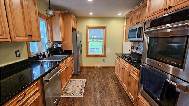 5267 Wheeler Rd, Elbridge, NY 13166 - kitchen featuring appliances with stainless steel finishes, a sink, baseboards, decorative backsplash, and dark wood-style floors