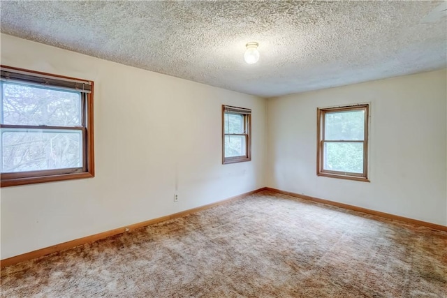 16 Welch Ave, Hamlin, NY 14470 - empty room featuring carpet floors, a textured ceiling, and baseboards