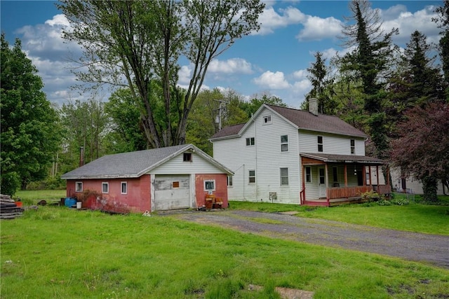 16 Welch Ave, Hamlin, NY 14470 - view of property exterior with an outbuilding, driveway, a yard, and a porch