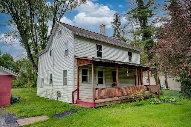 16 Welch Ave, Hamlin, NY 14470 - view of front of house featuring a chimney, a front yard, and a porch