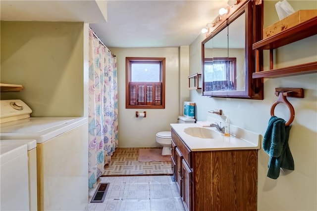16 Welch Ave, Hamlin, NY 14470 - bathroom with independent washer and dryer, toilet, vanity, tile patterned floors, and a shower with curtain