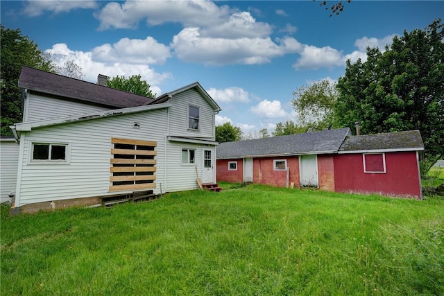 16 Welch Ave, Hamlin, NY 14470 - rear view of property featuring a lawn