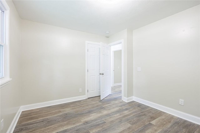 162 Berkshire Dr, Greece, NY 14626 - spare room with wood finished floors and baseboards