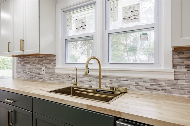 162 Berkshire Dr, Greece, NY 14626 - kitchen with wooden counters, a sink, tasteful backsplash, and plenty of natural light
