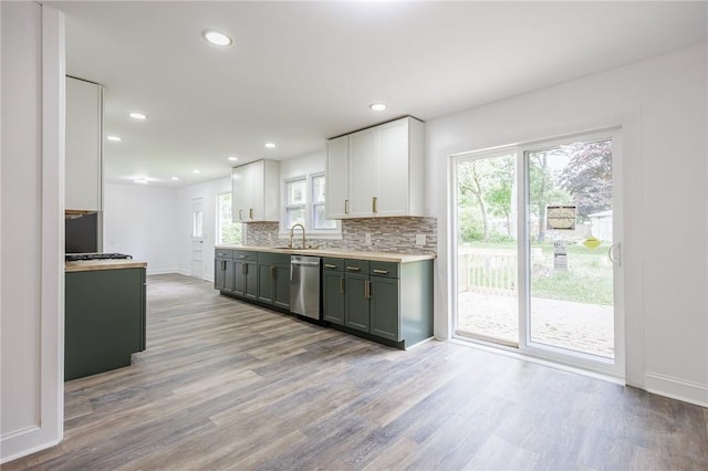 162 Berkshire Dr, Greece, NY 14626 - kitchen featuring stainless steel dishwasher, baseboards, light wood-style floors, backsplash, and recessed lighting